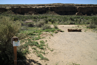 campsite with an "open" sign
