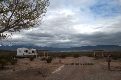 two RV campsites, one with an RV in it.
