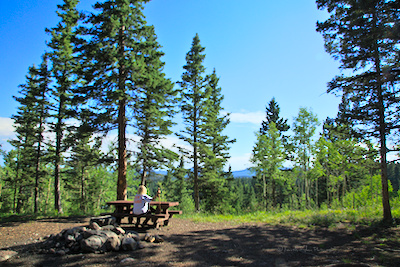 Diana Northup sitting at a table in the Upper Lagunitas campground.
