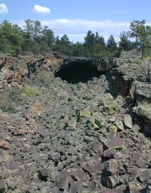 Collapsed lava tube with a cave at the end
