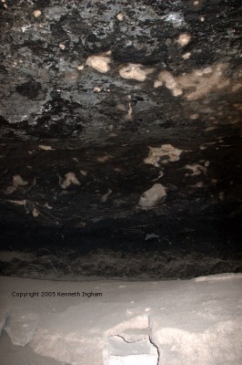inside of cave with soot-blackened ceiling
