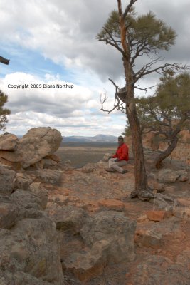 Kenneth near the trail, with a view of the Zuni mountains behind him.
