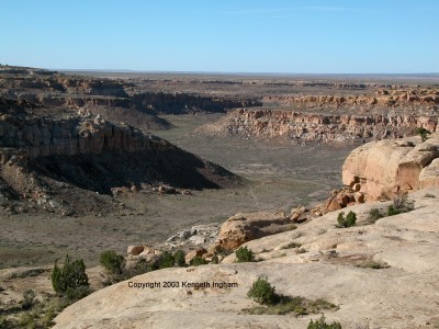 trail in valley between mesas
